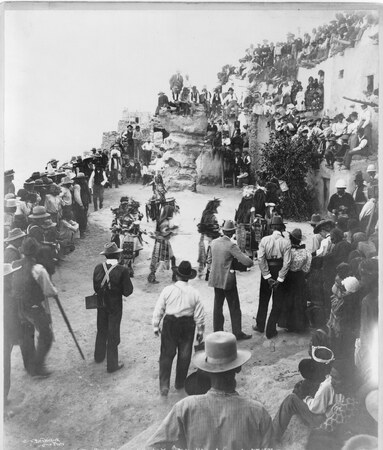 Antelope priests enter Walpi’s plaza on August 21, 1897, with Copelli at the head of the line. The bullroarer is not visible in Ben Wittick’s...