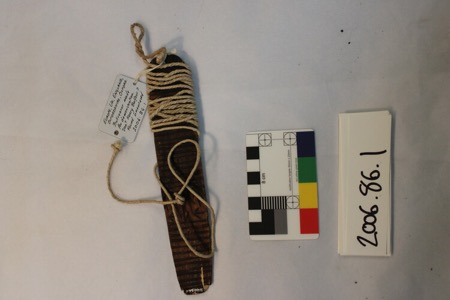 A wooden board wound with cord at the Pitt Rivers Museum, its paper tag noting an uncertain findspot — a generic European stand-in, since...