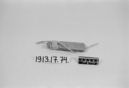 An Arab bull-roarer, a short wood block bound with cord at its middle; the Bobo aliwe, a metal rhombe tied to a cord and revealed among the Dwo...