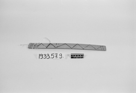 A tapering wooden blade painted with a zigzag border and bound with cord near its wide end, labelled "Yoruba, uncertain" — shown for the...