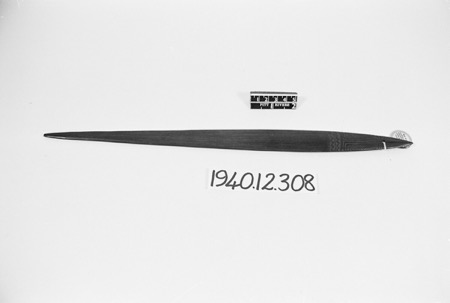 A plain Gulf palmwood blade, PRM 1940.12.308, incised banding at the cord end.