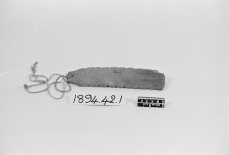 Bungay bullroarer cut from recycled wood, with its terminal cord, Pitt Rivers Museum 1894.42.1.