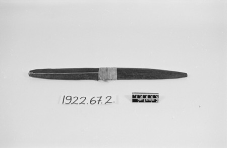 Igbo wooden bullroarer with its attached cord, Pitt Rivers Museum 1922.67.2.