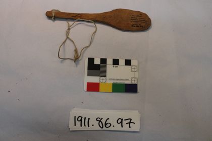 The schoolboys' ual ual: a hand-sized paddle on its cotton string.