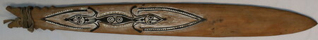 Painted Orokolo bull-roarer with zoomorphic motifs and serrated borders (Pitt Rivers Museum 1938.36.298).