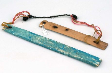 A bamboo snorrebot from Flores, one slat left natural and its twin painted blue, both pierced and strung on cord — the coastal type nearest the...