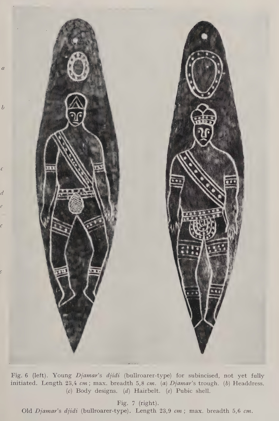 Two pointed Djamar boards, each pierced near the top and engraved with a standing man and body ornaments.